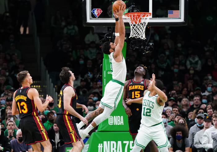 Mar 1, 2022; Boston, Massachusetts, USA; Boston Celtics forward Jayson Tatum (0) makes the basket against the Atlanta Hawks in the second quarter at TD Garden.
